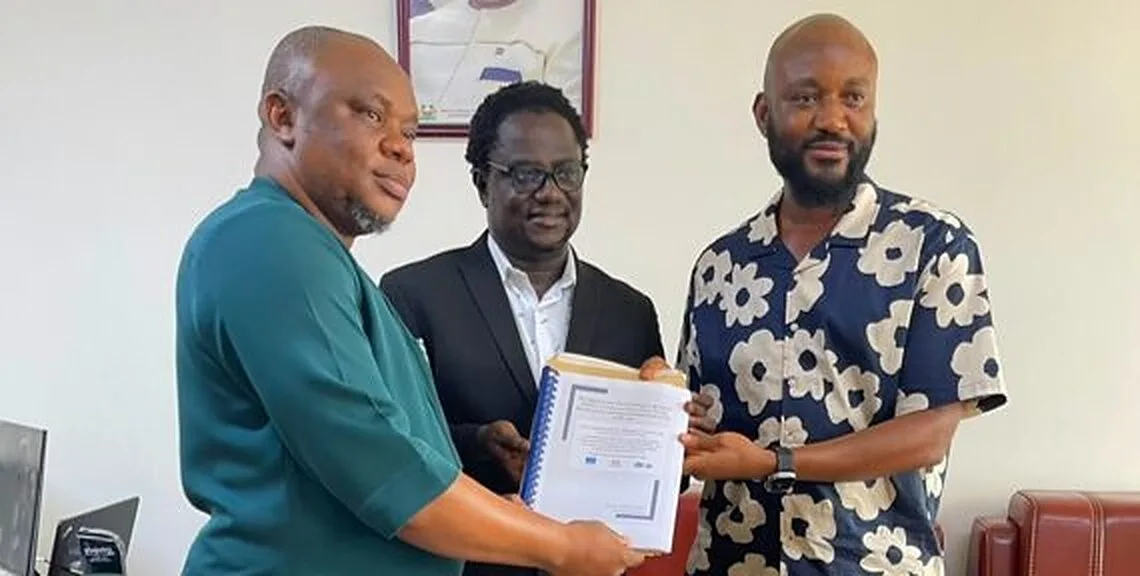 MRCG National Coordinator Dr Francis Sowa presents the reform package to Deputy Minister Bockarie Aziz Bawoh